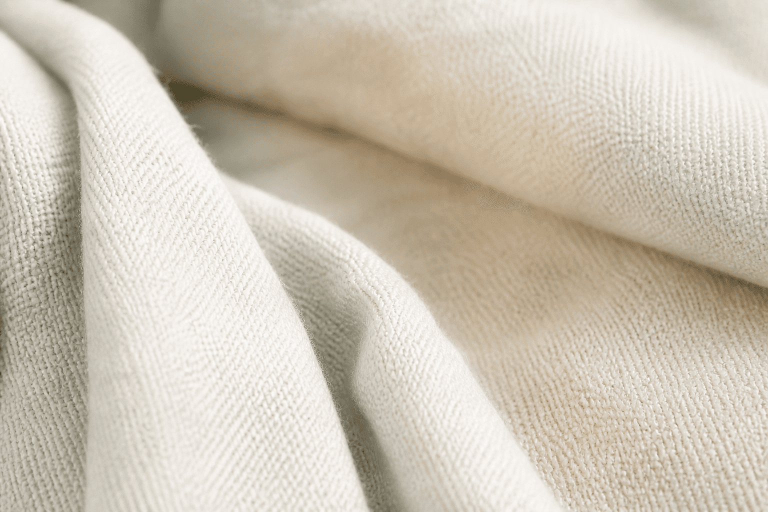 Close folds of soft ivory fabric