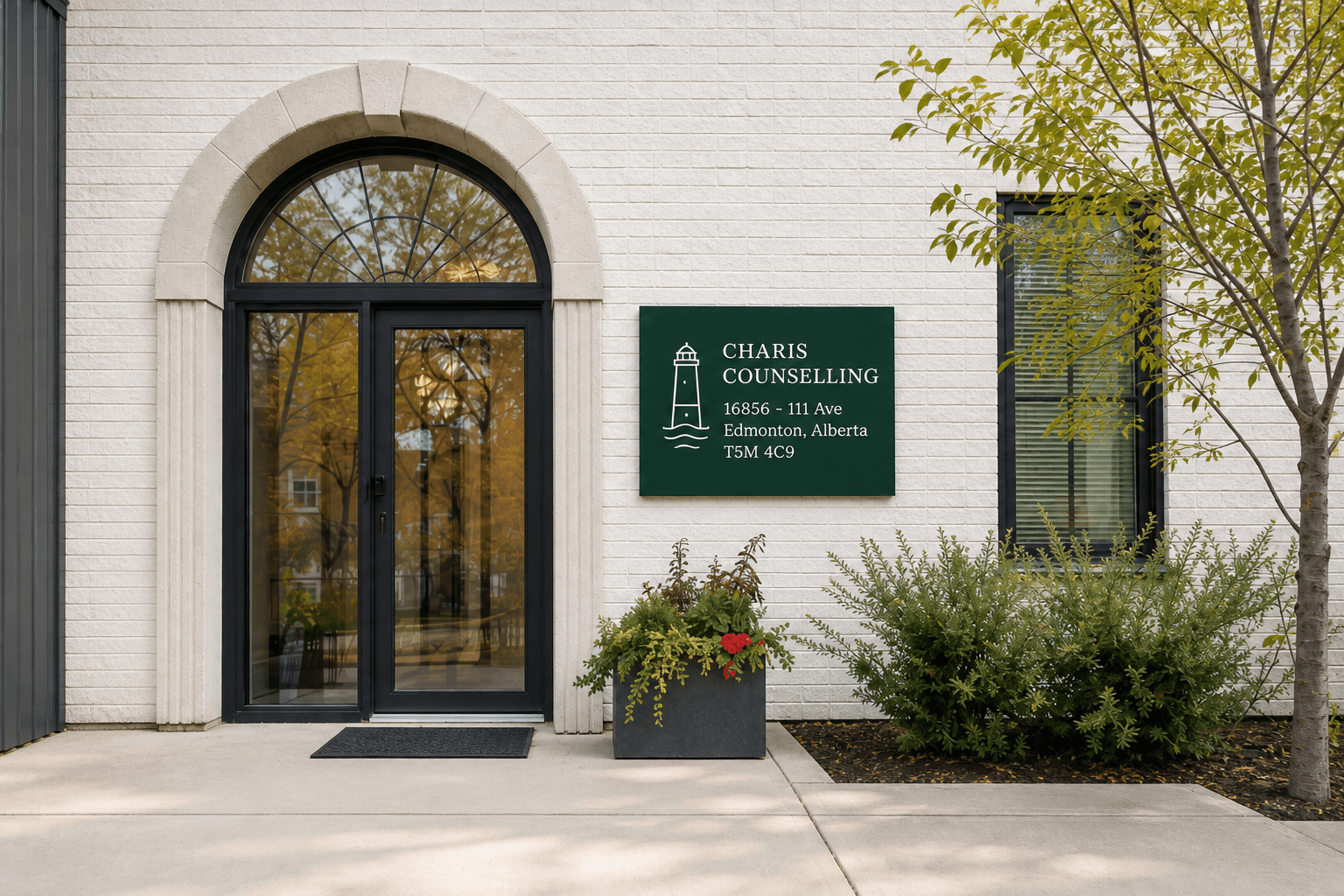 Charis Counselling office facade with arched glass doors, front walkway, windows, planting, and street context